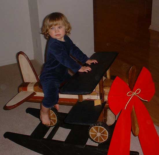 aly on toby's new plane (from oma & grandpa)