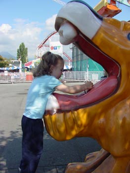 aly drinking from the lion water fountain