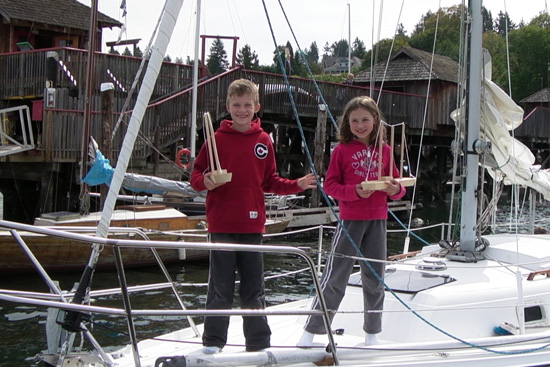 aly and toby with their wooden boats