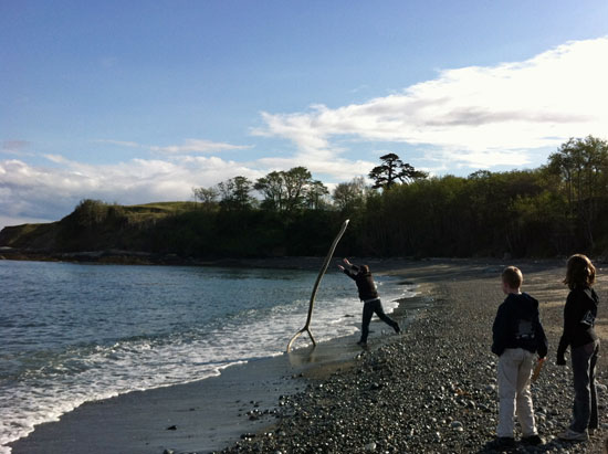 mike throwing a giant fork into the ocean